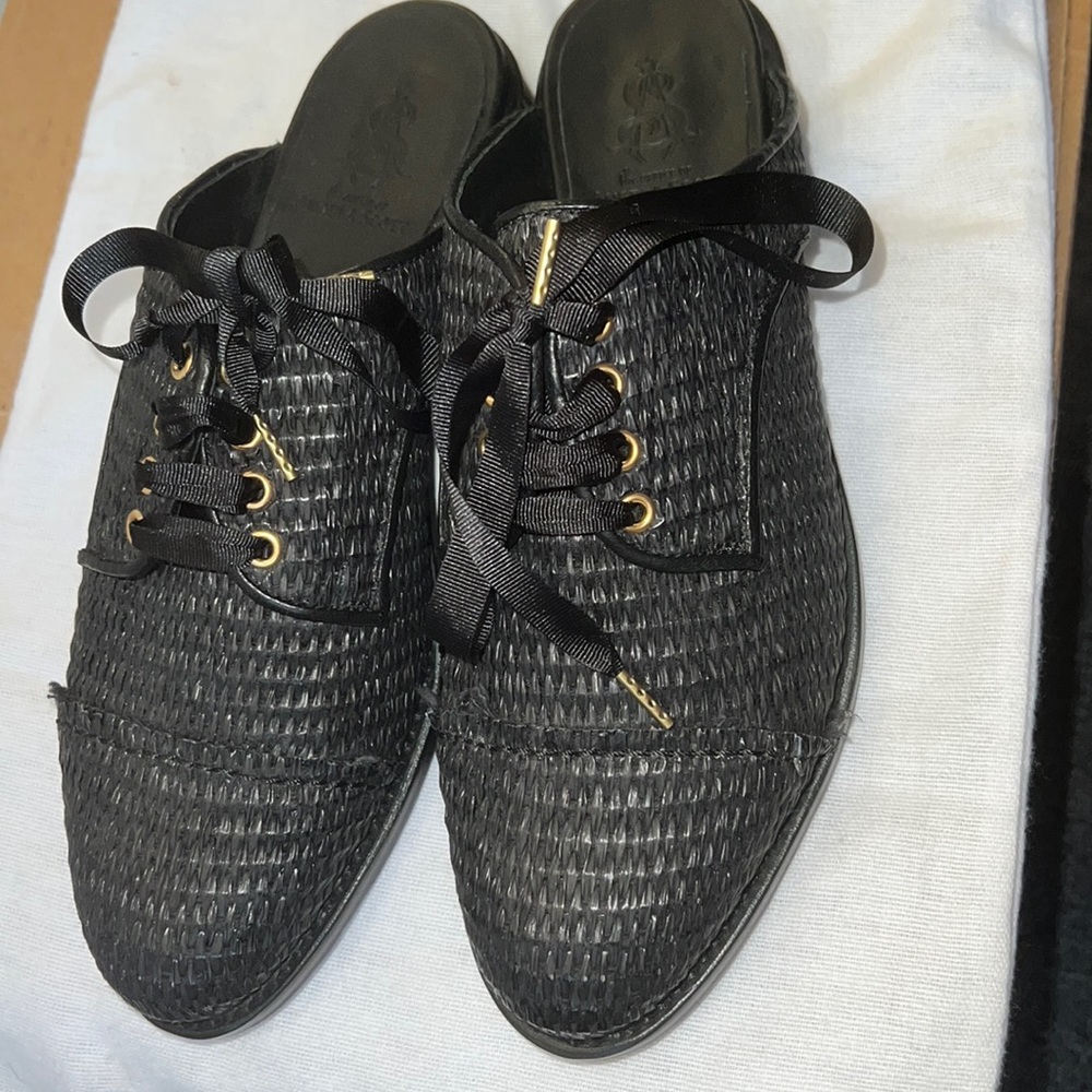 The office of Angela Scott slip on flats